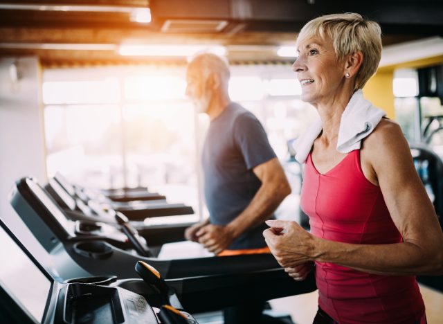 Mature woman exercising on treadmill