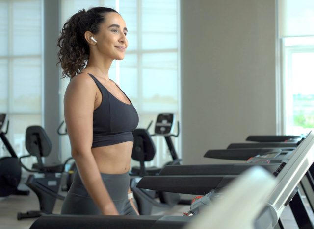 a woman doing a treadmill walking in the gym