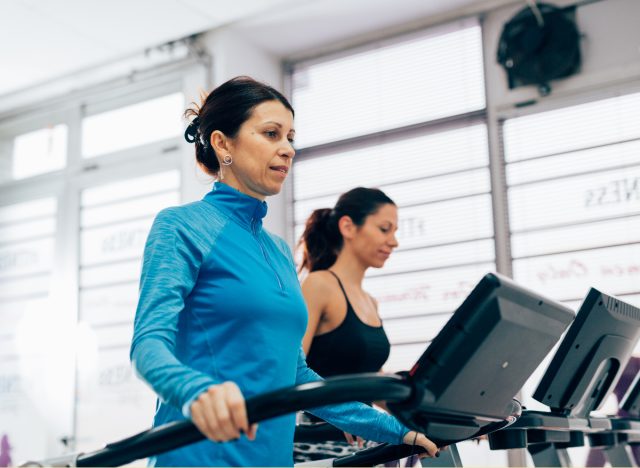 A middle-aged woman on a treadmill to show the mistakes that ruin your weight loss